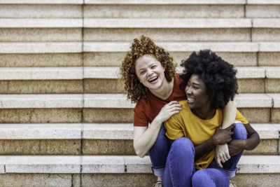 two teens laughing