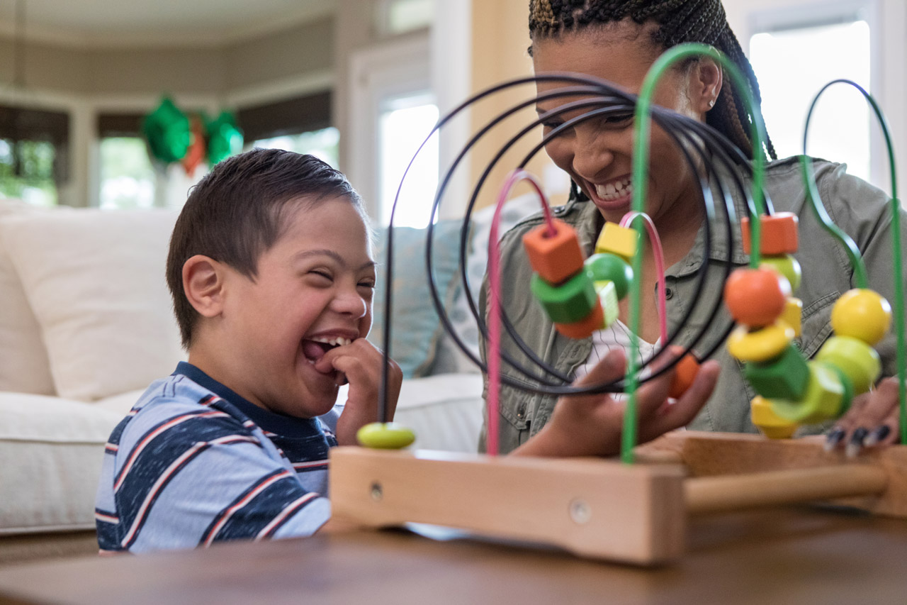 child playing with table game