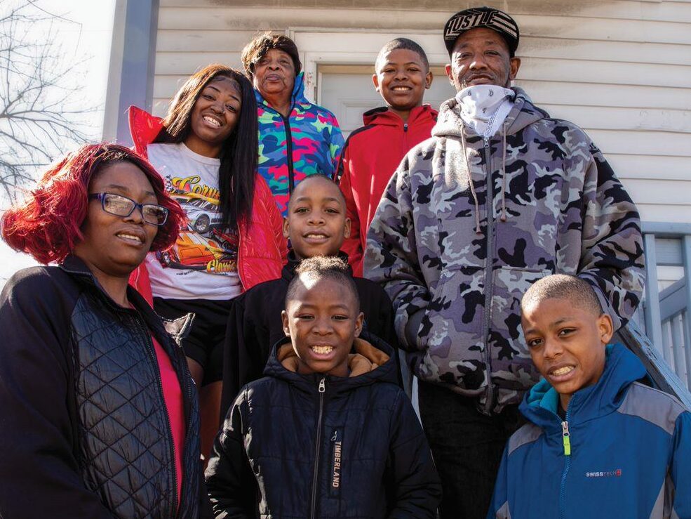 Family in front of home
