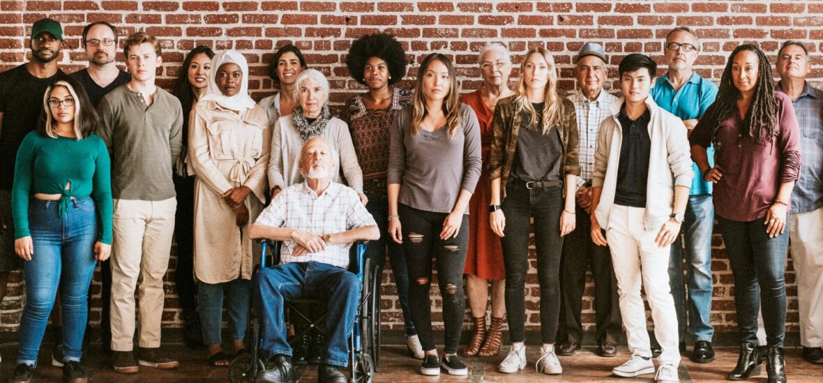 group of diverse people standing against wall