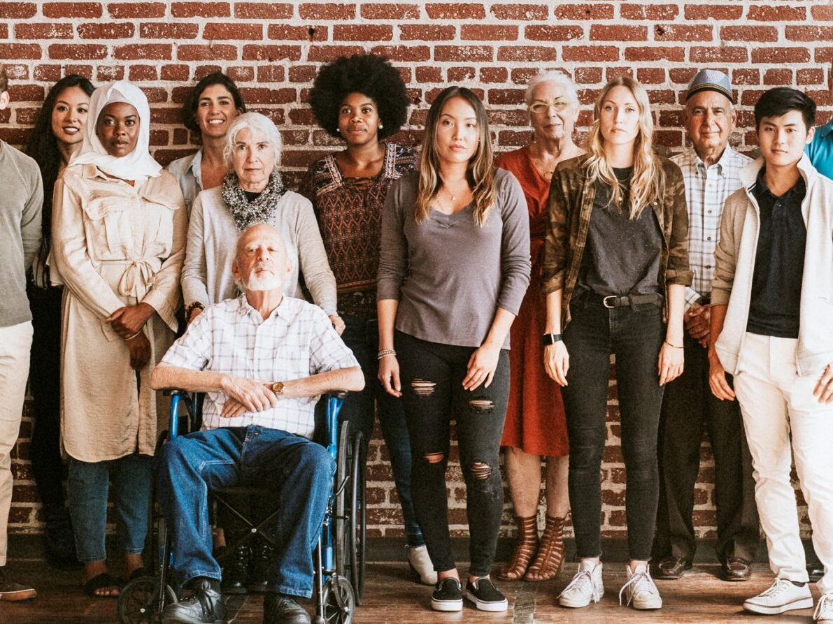 group of diverse people standing against wall