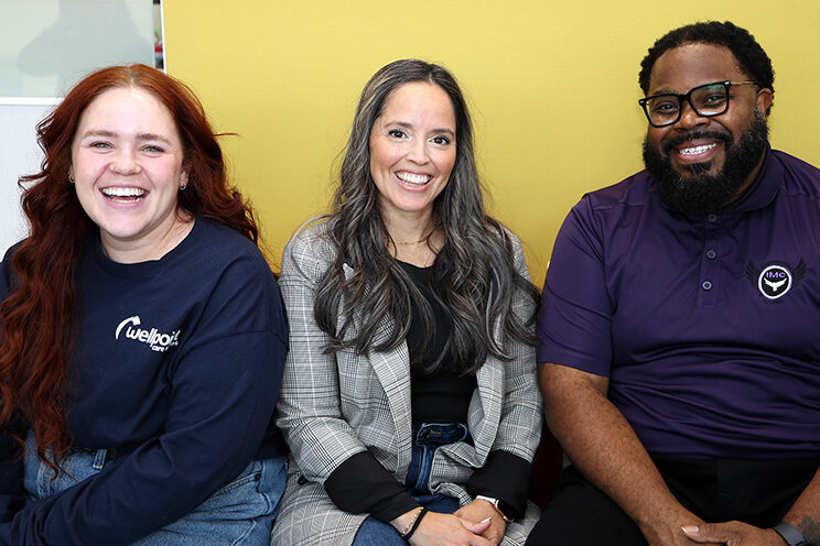 A Wellpoint Care Student Associate laughing with staff members