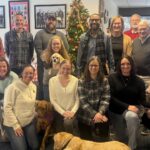 group of people in front of tree
