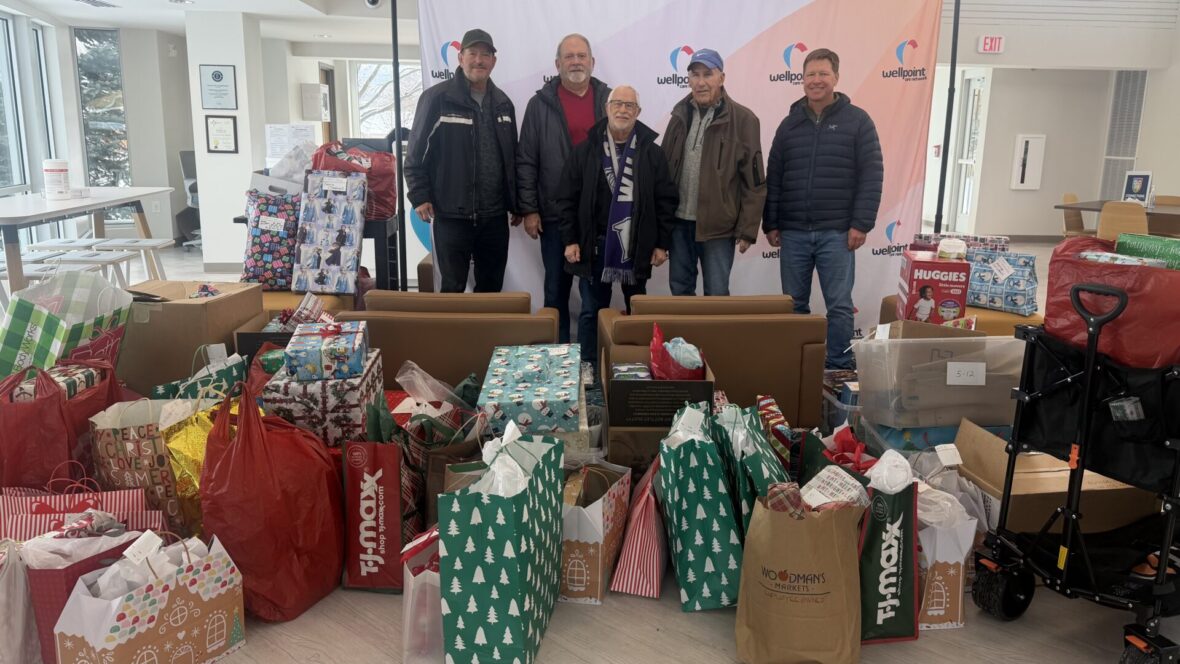 group of people in front of gifts