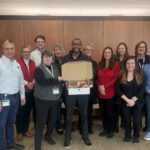 group of people with donuts