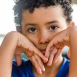 young boy looking sad