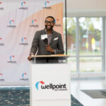 man standing at podium