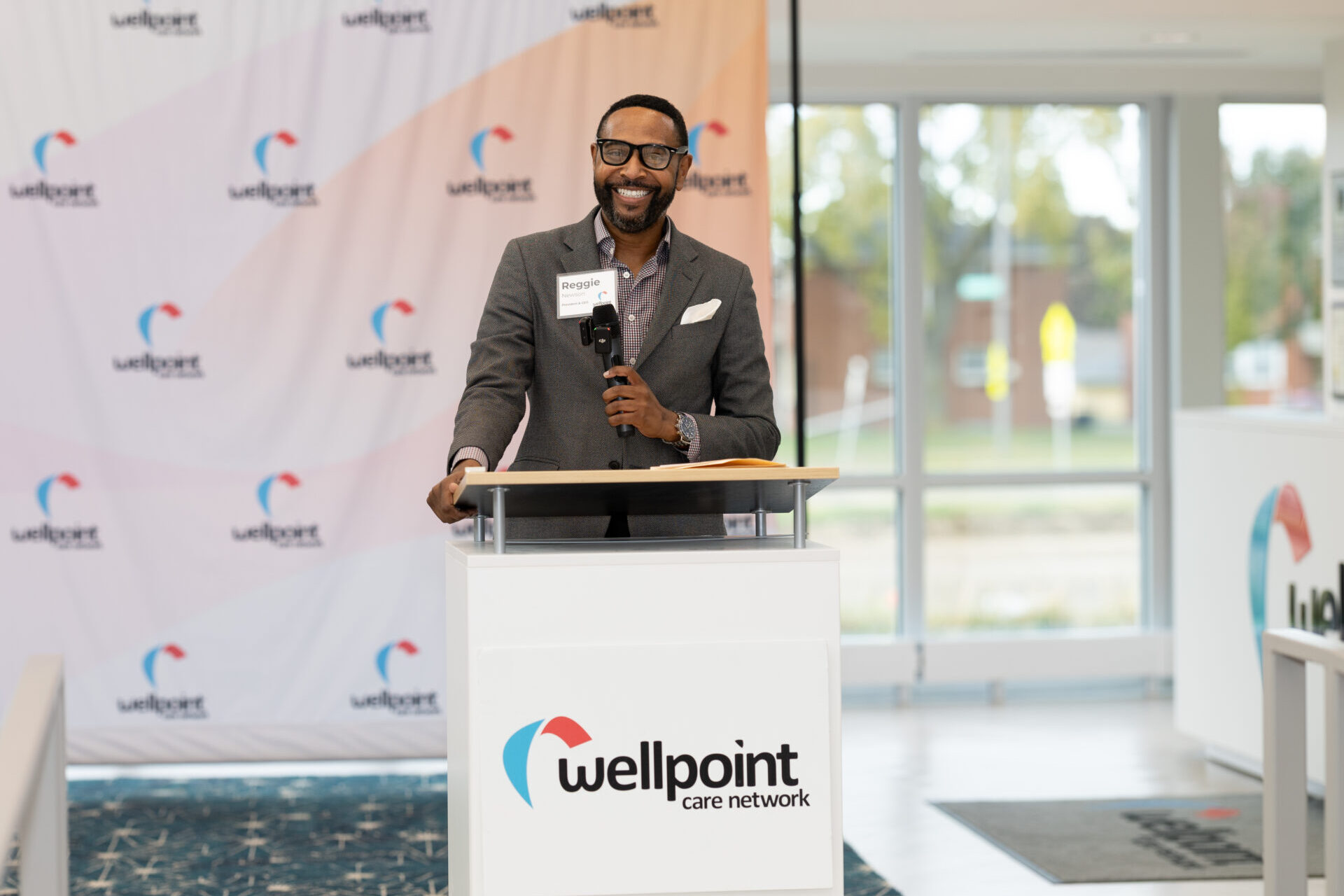 man standing at podium