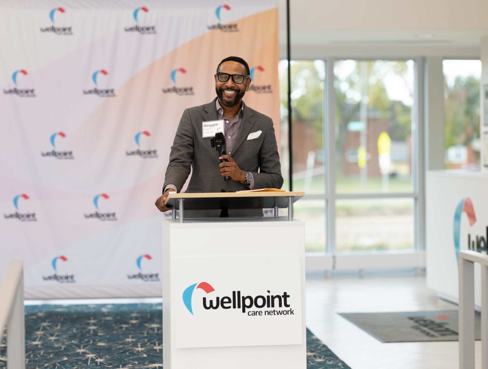 man standing at podium