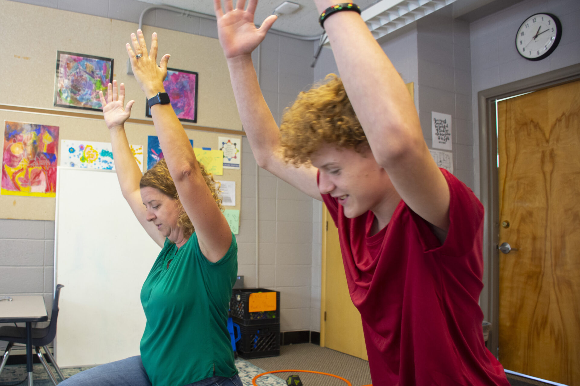 therapist and teen stretching