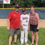 family on baseball field