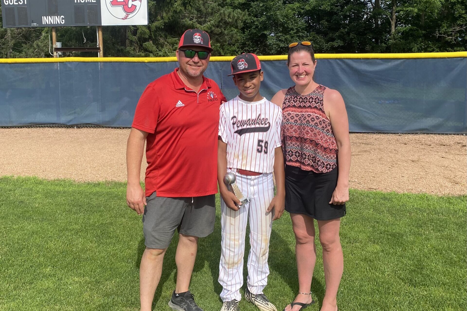 family on baseball field
