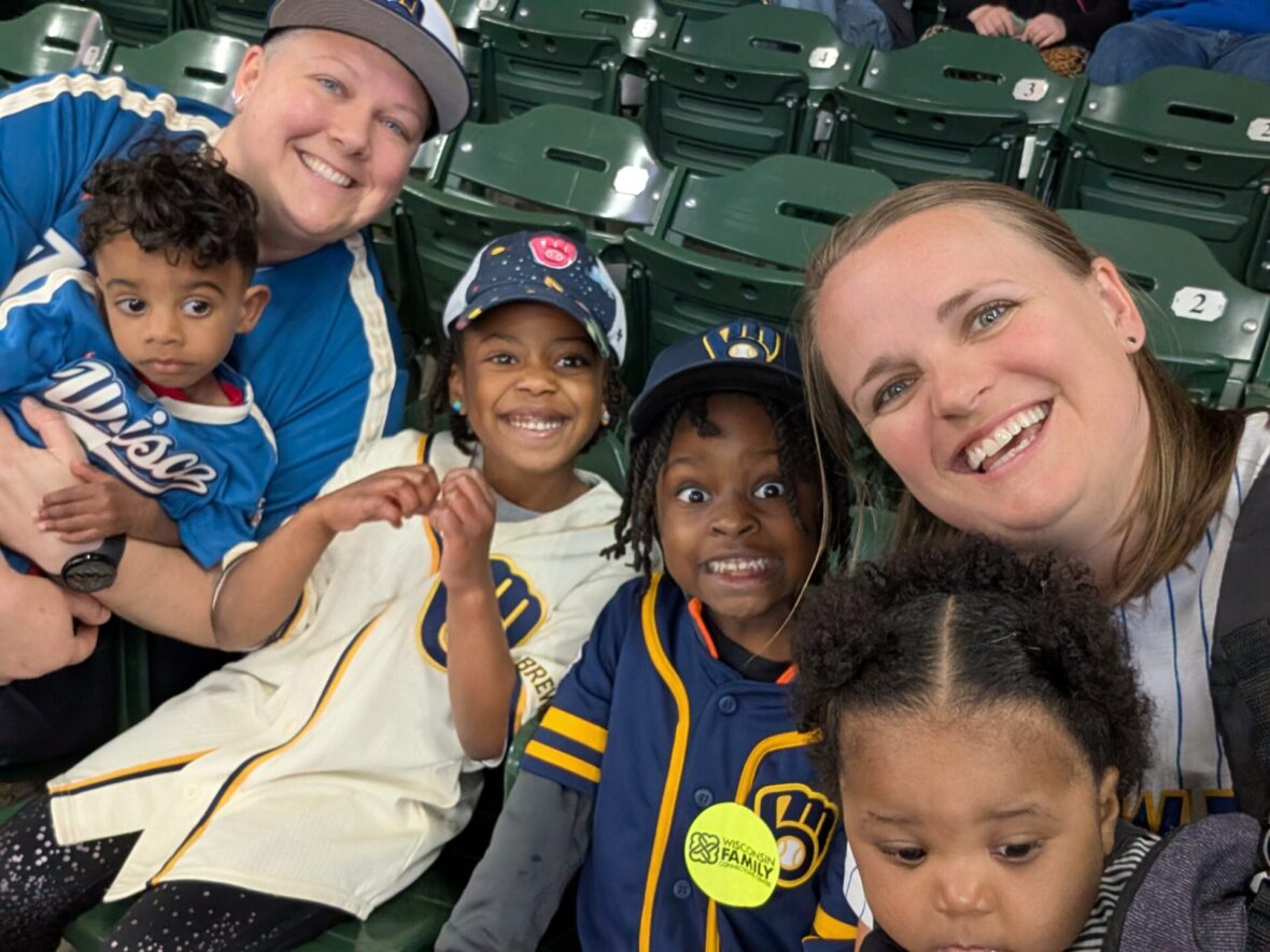 smiling at baseball game