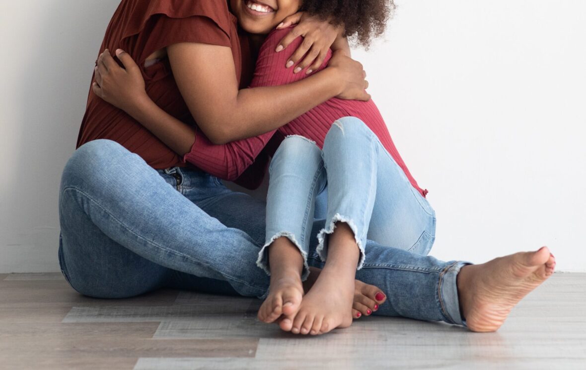 Parent and kid hugging