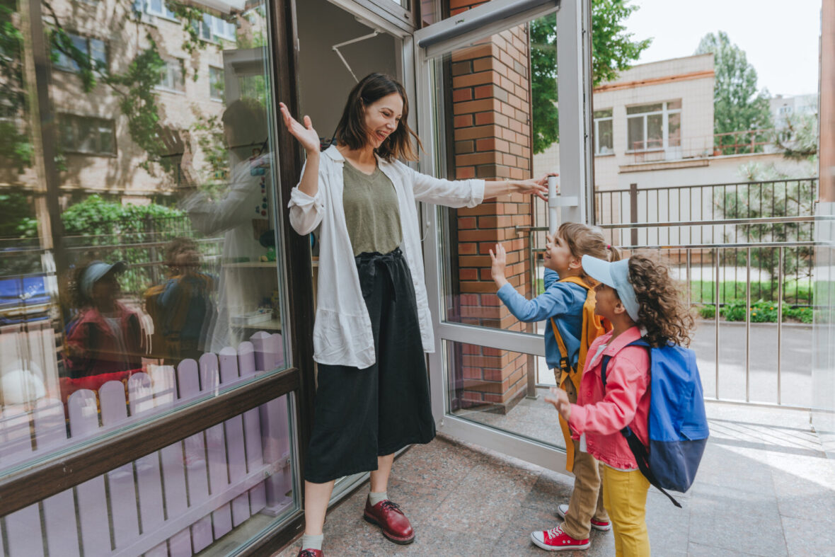 woman waving at kids