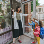 woman waving at kids