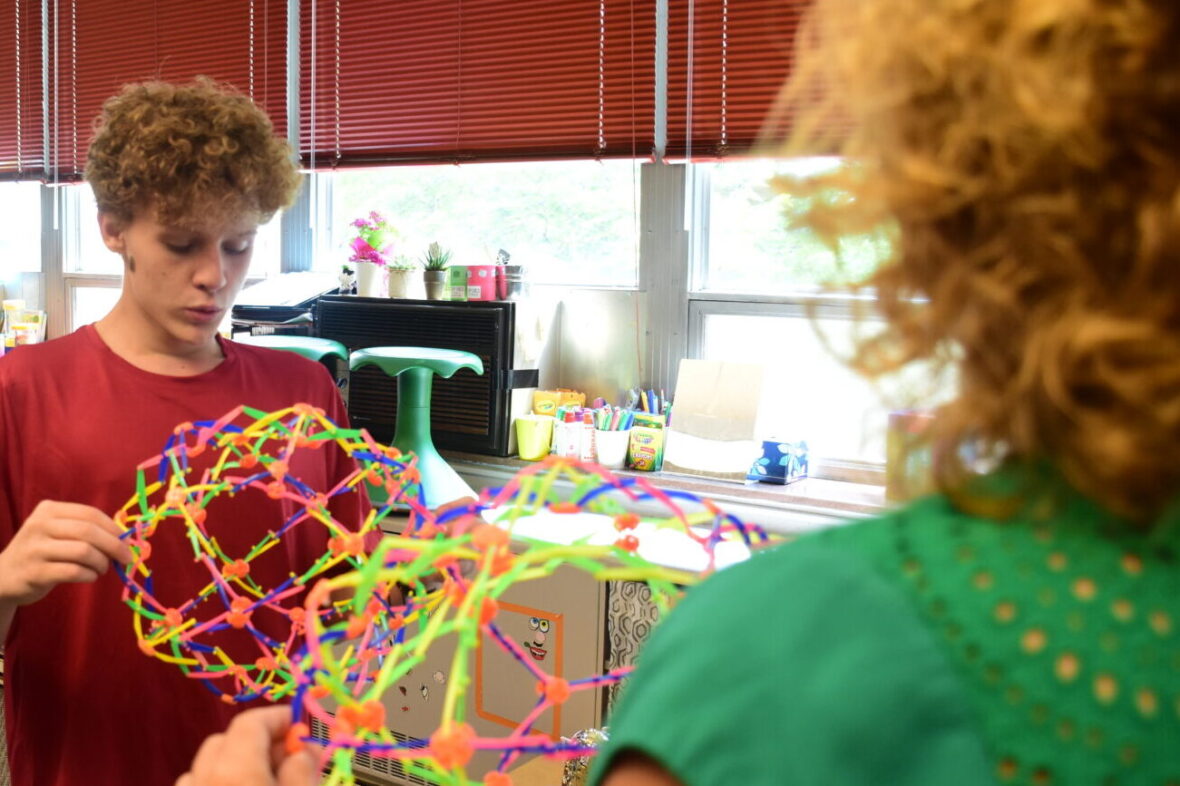Pediatric Occupational Therapist Elizabeth Morgan works with a client using a colorful expanding ball
